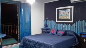 Un pat sau paturi într-o cameră la Casa il Soffio di Eolo