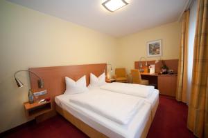 Postel nebo postele na pokoji v ubytování Hotel Mehl
