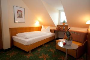 Ένα ή περισσότερα κρεβάτια σε δωμάτιο στο Hotel Mehl