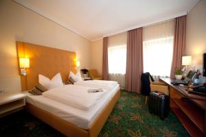 Postel nebo postele na pokoji v ubytování Hotel Mehl