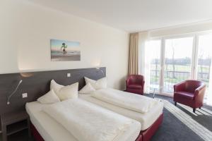 Postel nebo postele na pokoji v ubytování Hotel Bloemfontein
