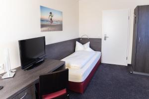 TV a/nebo společenská místnost v ubytování Hotel Bloemfontein