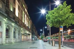 an empty city street at night with street lights at Riu Plaza The Gresham Dublin in Dublin