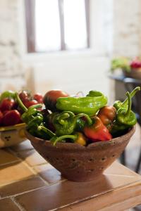 a bowl of vegetables sitting on a table at Residenza d'Epoca Borgodifiume in Fiumefreddo Bruzio