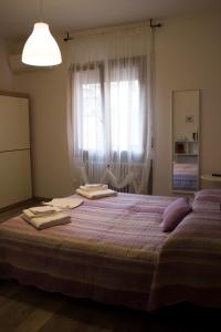 Postel nebo postele na pokoji v ubytování Albergo Felice
