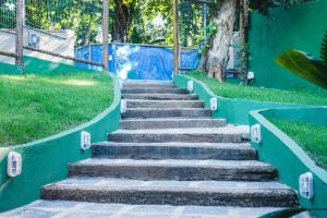 a row of stairs leading up to a park at Hostel Refúgio in Abraão