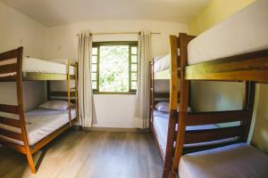 Cama ou camas em um quarto em Hostel Refúgio