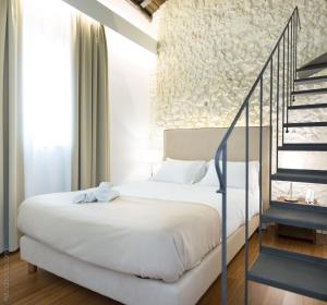 A bed or beds in a room at Arcipelago 41