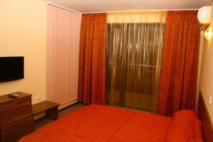 En eller flere senge i et værelse på Hotel Rusalka