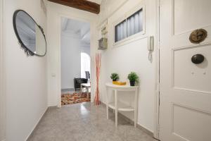 Televízia a/alebo spoločenská miestnosť v ubytovaní Barcelona Just Like Home