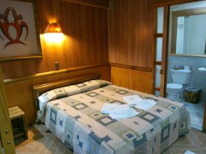 Uma cama ou camas num quarto em Hotel Manavai
