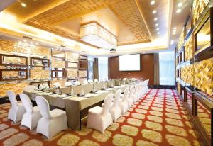 TV a/nebo společenská místnost v ubytování Glenview ITC Plaza Chongqing