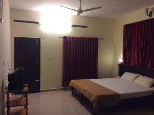 Cama o camas de una habitación en Kerala House