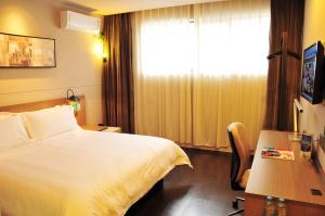 En eller flere senge i et værelse på JinJiang Inn Wujiang Tongli Yunli Bridge