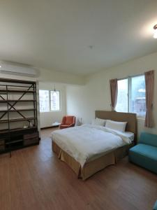 Postel nebo postele na pokoji v ubytování Long Zhi Yue Hotel