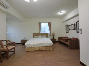 Postel nebo postele na pokoji v ubytování Long Zhi Yue Hotel