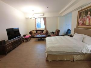 Postel nebo postele na pokoji v ubytování Long Zhi Yue Hotel