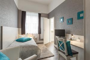 Μια τηλεόραση ή/και κέντρο ψυχαγωγίας στο Hotel Atlantic Travemünde