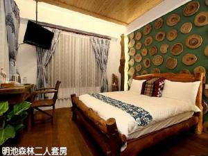Postel nebo postele na pokoji v ubytování Beautiful Yilan Resort