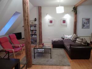 a living room with a couch and a table at Chalet Bovec in Bovec