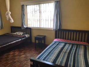 Postel nebo postele na pokoji v ubytování Teule Guest House