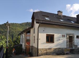 a house with a view of a mountain at Jaśminowe Ogrody in Szczyrk