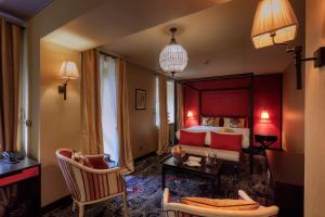 a hotel room with a bed and a table and chairs at Vozdvyzhensky Boutique Hotel in Kyiv +89 photos