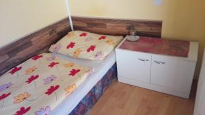 Postel nebo postele na pokoji v ubytování Turistická ubytovňa pri Slovenskej reštaurácii