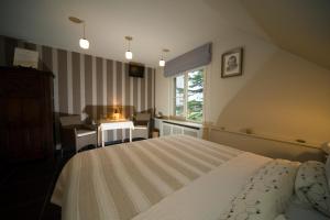 Letto o letti in una camera di B&B Artiriacumhoeve