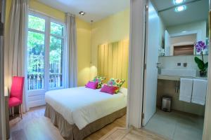 a bedroom with a large bed and a large window at BacHome Terrace B&B in Barcelona