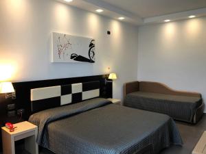 Postel nebo postele na pokoji v ubytování Hotel Visagi + 37 fotografií