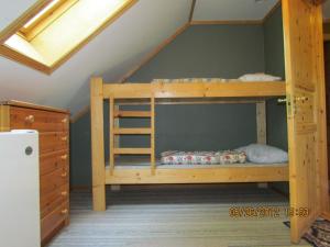 En eller flere senge i et værelse på Bondegårdsparken Farm Holiday