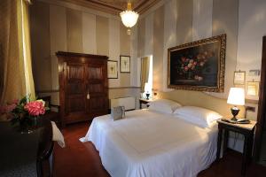 Postel nebo postele na pokoji v ubytování Hotel Villa Beccaris