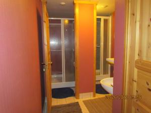 a bathroom with a shower and a toilet in it at Bondegårdsparken Farm Holiday in Kristiansand +56 photos