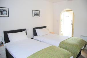 Cama o camas de una habitación en Hare & Hounds Bed & Breakfast