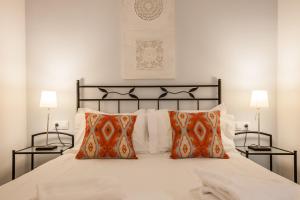 Postel nebo postele na pokoji v ubytování SevillaHome - Marqués de Paradas