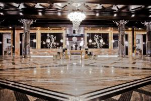 a dance floor in a room with a chandelier at Villas Elenite Premium in Elenite +36 photos