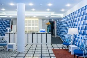 
a room with a blue floor and a blue wall at Terrace Mar Suite Hotel in Funchal
