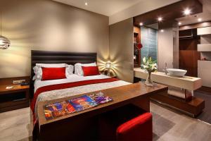 Posteľ alebo postele v izbe v ubytovaní Olivia Plaza Hotel
