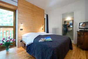 Postel nebo postele na pokoji v ubytování B&B Il Bucaneve