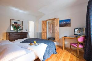 Postel nebo postele na pokoji v ubytování B&B Il Bucaneve