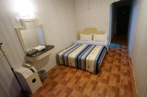 Letto o letti in una camera di Yi Yuan Hotel