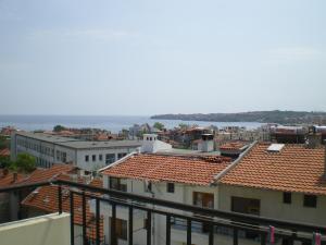 a view of roofs of buildings and the water at Guest House Diamant in Sozopol