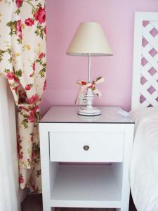 A bed or beds in a room at Villa Kiza Apartments