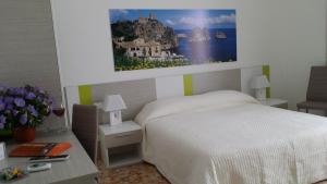 A bed or beds in a room at Terrazze Villanova