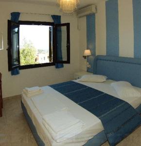 Posteľ alebo postele v izbe v ubytovaní Perla Apartments