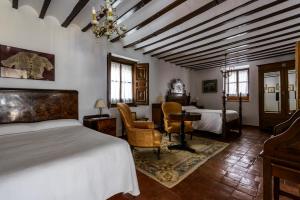 Säng eller sängar i ett rum på Hotel Rural Tia Pilar