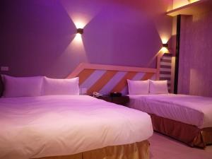Katil atau katil-katil dalam bilik di Wei Feng Exquisite Motel Pintung Branch