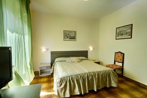 Postel nebo postele na pokoji v ubytování Albergo Mancuso del Voison