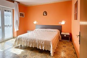 Postel nebo postele na pokoji v ubytování Albergo Mancuso del Voison